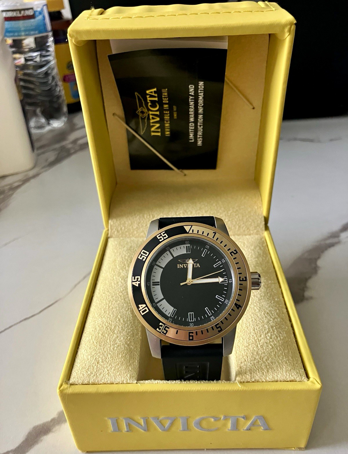 Invicta Analog Wristwatch Black Dial Gold/Black Bezel Silver Case Rubber Strap