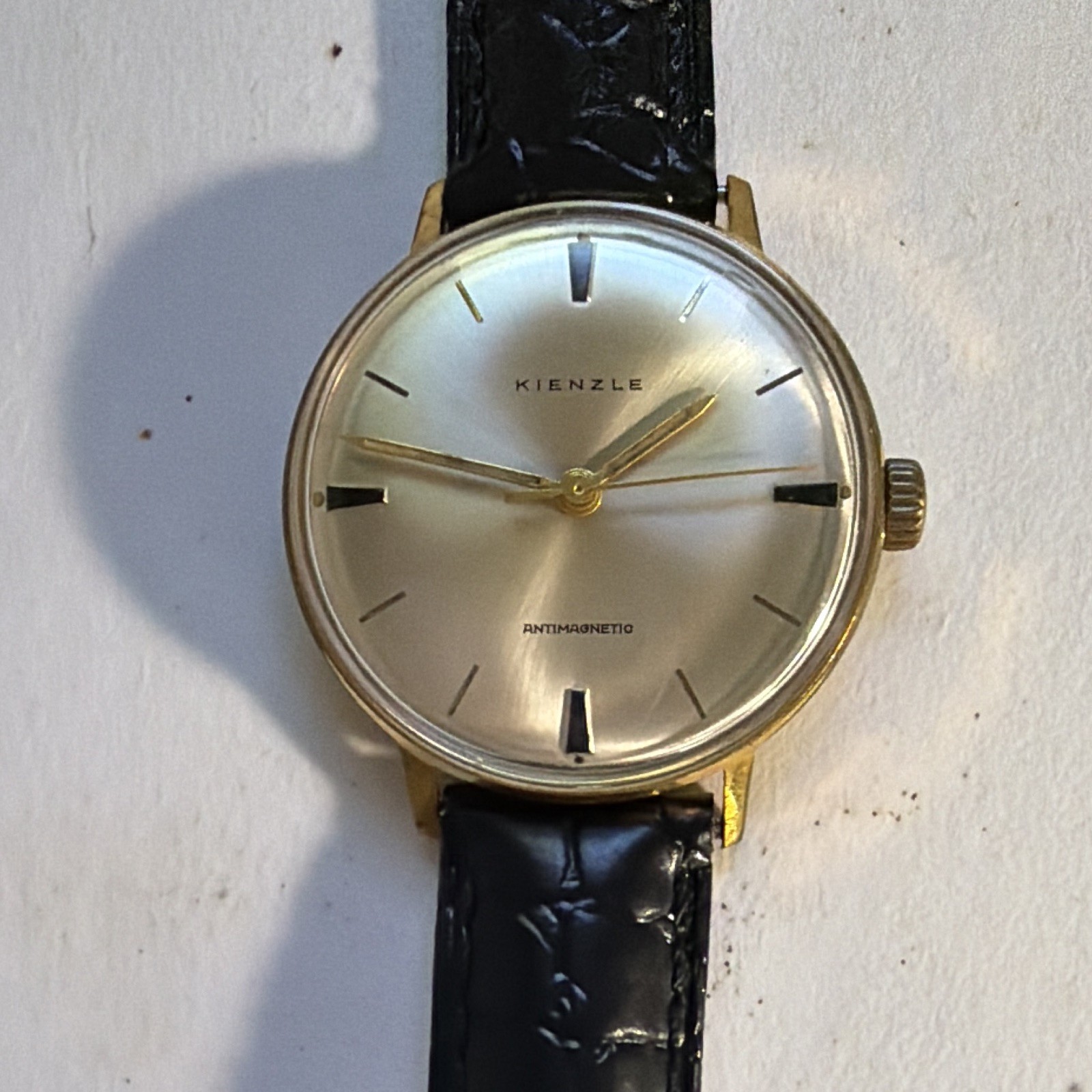 Kienzle Antimagnetic Manual Gold Tone Silver Baton Dial Black Leather Strap
