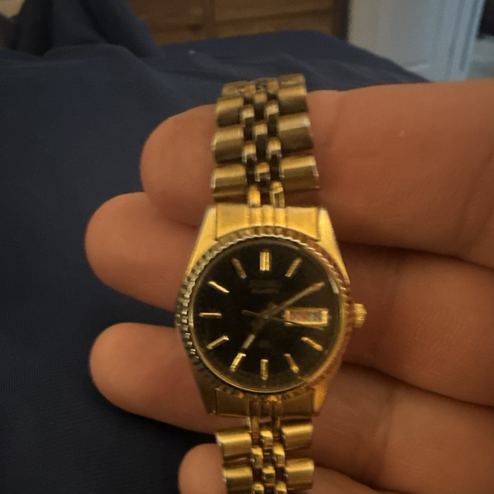 Seiko Quartz women’s Dress Watch Day/Date Black Dial Gold Tone Metal Bracelet
