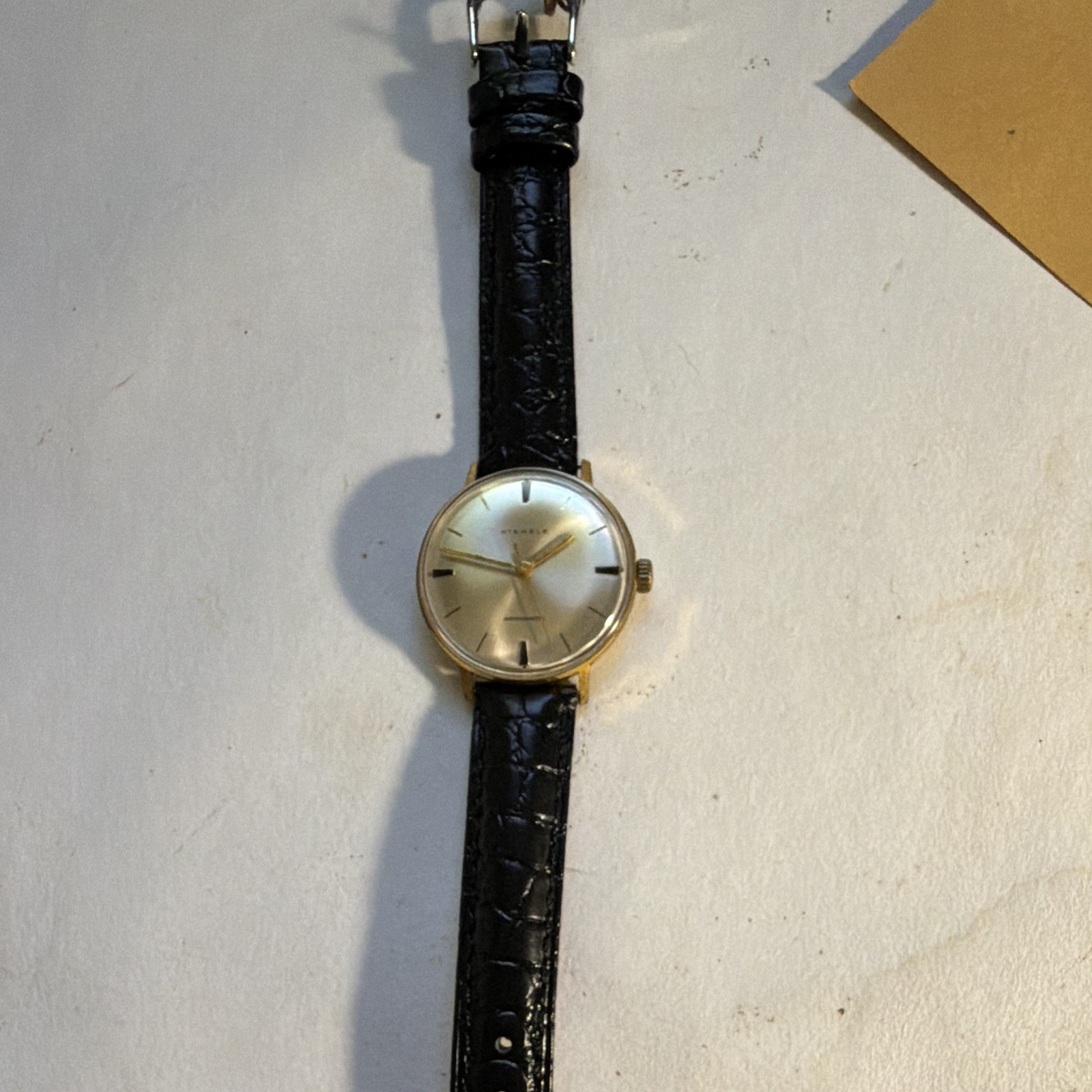 Kienzle Antimagnetic Manual Gold Tone Silver Baton Dial Black Leather Strap