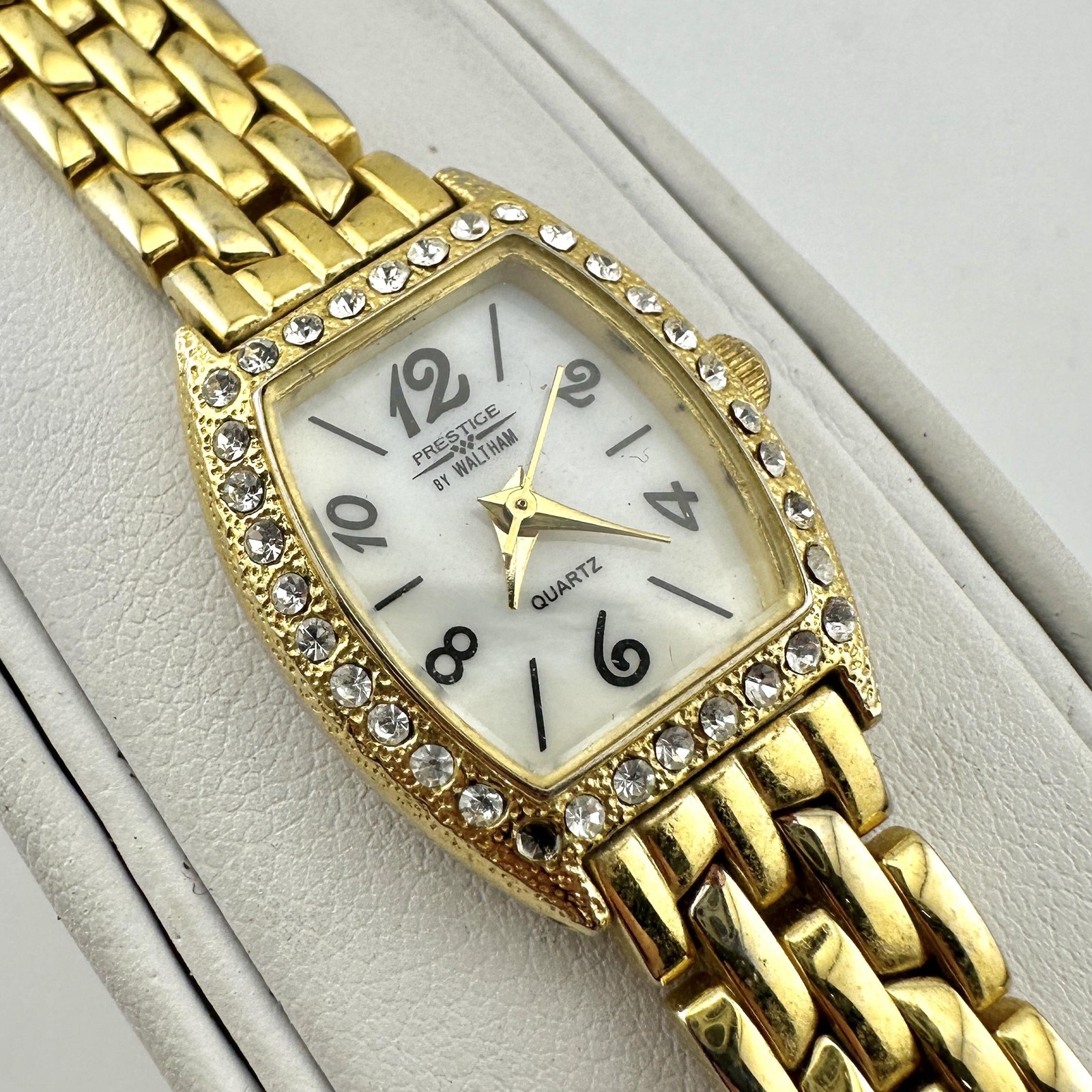 Prestige by Waltham Womens Gold Tone Tonneau Quartz Watch Crystal Bezel Japan