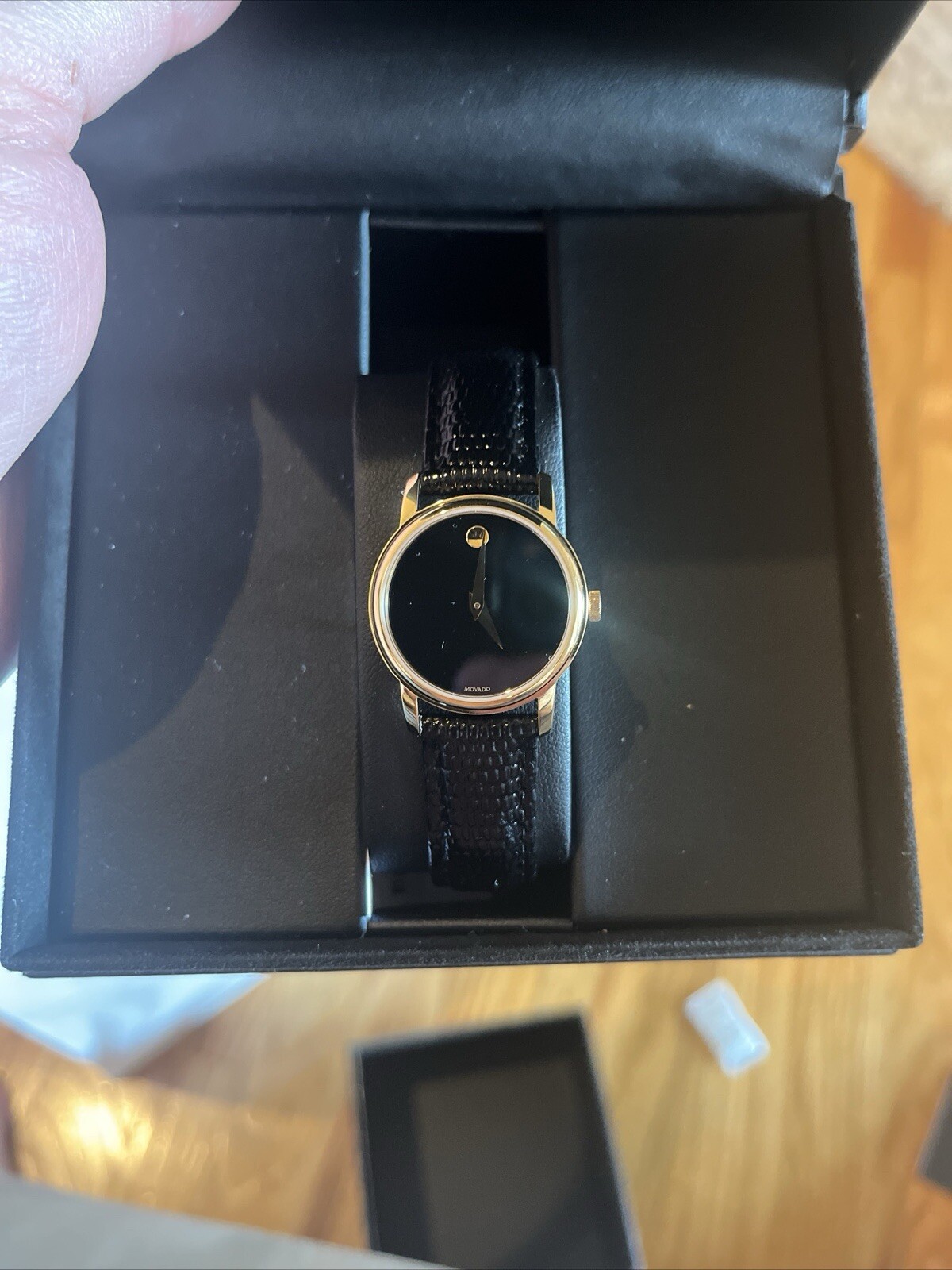 movado mens and woman’s watch