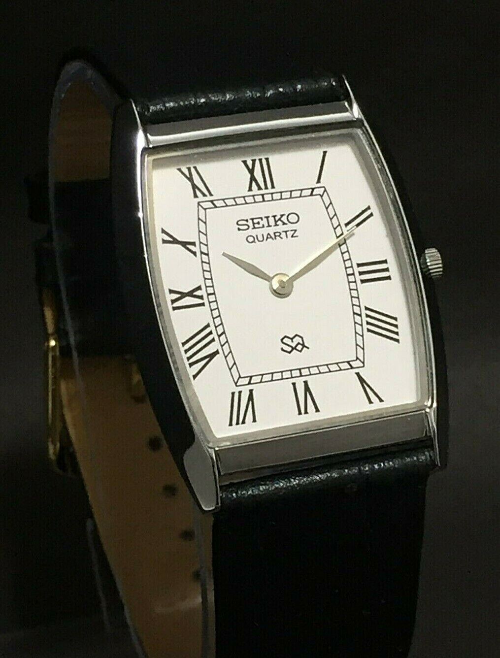 Vintage Seiko Slim Quartz White Face Curve Silver Japanese 30MM Mens Watch S13