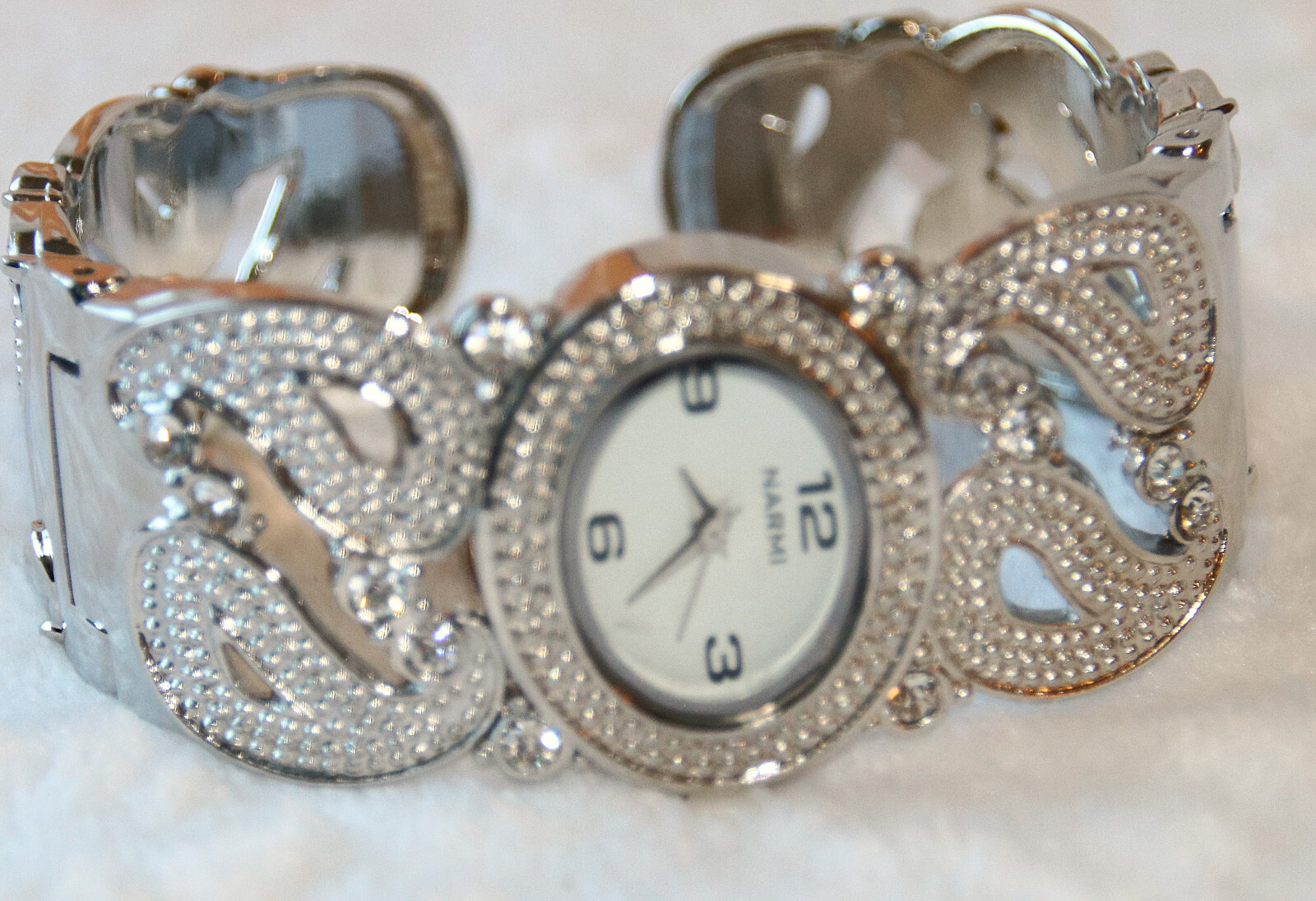 Silver Narmi Cuff Watch, clear rhinestones, quartz movement, spring hinge