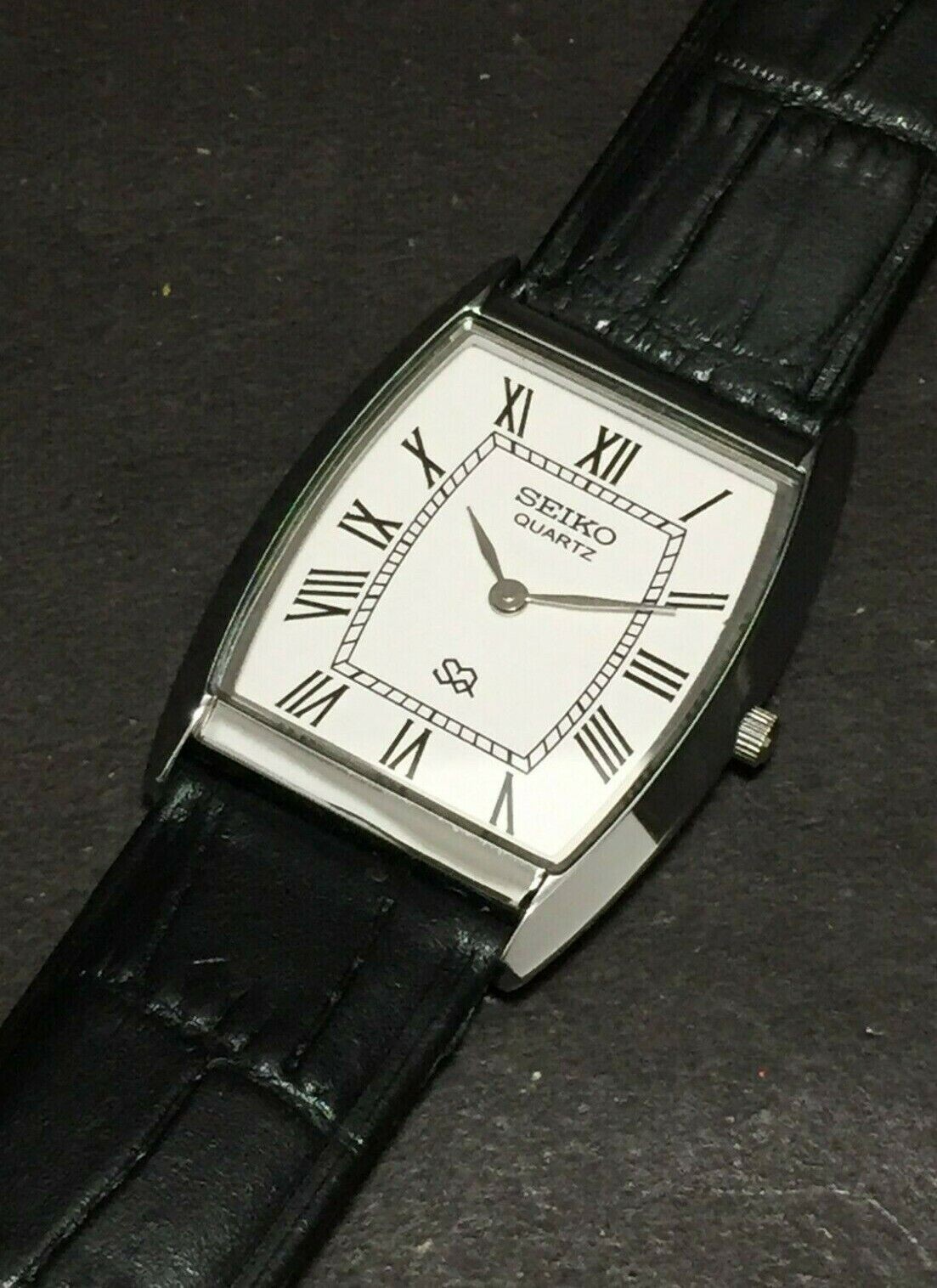 Vintage Seiko Slim Quartz White Face Curve Silver Japanese 30MM Mens Watch S13