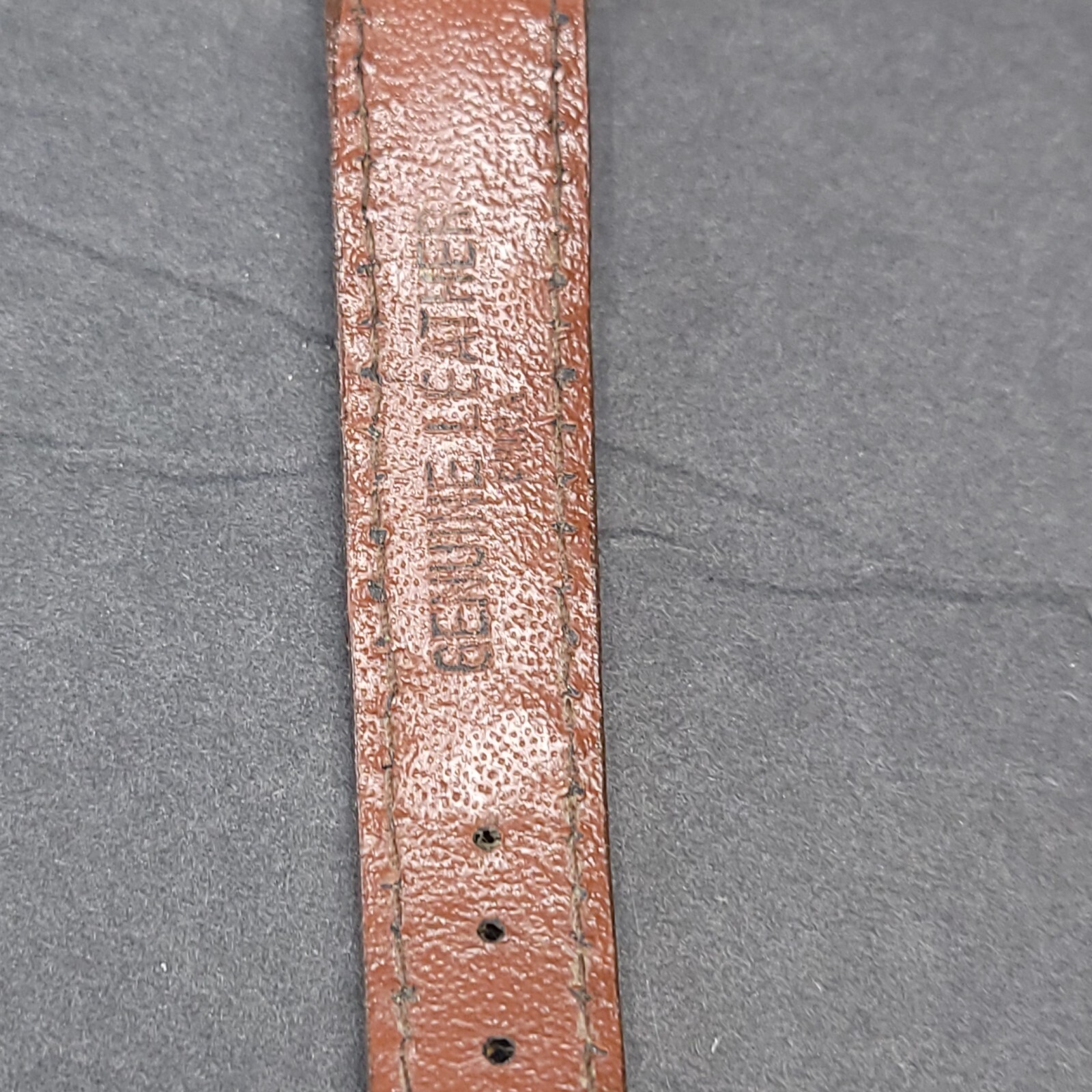 Gitano Analog Wriswatch with a Buckle Band and Quartz Movement