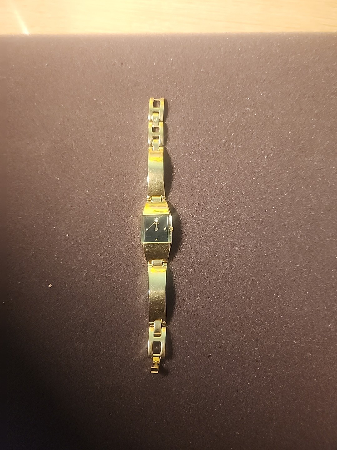 Guess G66005L ladies watch with a gold-tone bracelet